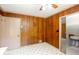 Kitchen area with linoleum flooring and paneled walls, next to a closet at 4545 Gaydon Rd, Powder Springs, GA 30127