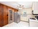 Eat-in kitchen with white cabinetry, linoleum floors, and stainless steel appliances at 4545 Gaydon Rd, Powder Springs, GA 30127