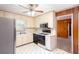 Kitchen featuring a gas range, white cabinets, and linoleum flooring at 4545 Gaydon Rd, Powder Springs, GA 30127