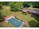 Aerial view showcases a backyard pool surrounded by lush landscaping and the home at 4545 Gaydon Rd, Powder Springs, GA 30127