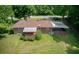 A rear exterior view showing the home's spacious backyard and covered carport at 4545 Gaydon Rd, Powder Springs, GA 30127