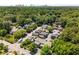 Aerial shot of densely wooded neighborhood with varied homes, showing proximity to the city skyline in the distance at 615 Pinetree Dr, Decatur, GA 30030