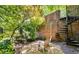 Charming backyard retreat with stone pathway, wrought iron fencing, and a spiral staircase to the upper level at 615 Pinetree Dr, Decatur, GA 30030