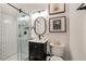 Modern bathroom with subway tile shower, glass door, black fixtures, and stylish vanity at 615 Pinetree Dr, Decatur, GA 30030