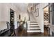 Inviting foyer with dark hardwood floors, a staircase with white risers, and access to other rooms at 615 Pinetree Dr, Decatur, GA 30030