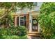 Attractive brick townhome featuring a decorative front door with a wreath, framed by manicured landscaping at 615 Pinetree Dr, Decatur, GA 30030