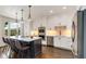 Modern kitchen featuring white cabinets, stainless steel appliances, and a large center island with barstool seating at 615 Pinetree Dr, Decatur, GA 30030