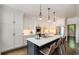 Well-lit kitchen featuring a center island with seating, modern appliances, and white cabinetry at 615 Pinetree Dr, Decatur, GA 30030