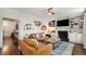 Elegant living room with hardwood floors, a fireplace, and built-in bookshelves for a comfortable ambiance at 615 Pinetree Dr, Decatur, GA 30030