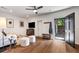 Inviting living room with hardwood floors, a comfortable sofa, and direct access to the outdoors at 615 Pinetree Dr, Decatur, GA 30030