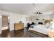 Spacious main bedroom with a fireplace, sitting area, dark wood floors, and natural light at 615 Pinetree Dr, Decatur, GA 30030