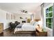 Bright main bedroom with a fireplace, dark wood floors, and neutral tones, creating a peaceful retreat at 615 Pinetree Dr, Decatur, GA 30030