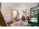 Stylish office featuring hardwood floors, a cozy rug, and custom green built-ins at 615 Pinetree Dr, Decatur, GA 30030