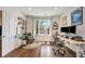 Bright office featuring a large window, hardwood floors, and a modern adjustable desk at 615 Pinetree Dr, Decatur, GA 30030