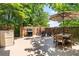 Outdoor patio featuring dining and seating areas, a grill and hot tub perfect for entertaining at 615 Pinetree Dr, Decatur, GA 30030