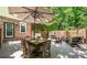 Outdoor patio featuring dining and seating areas perfect for entertaining with a beautiful brick privacy wall at 615 Pinetree Dr, Decatur, GA 30030