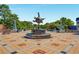 Sculptural fountain in public space enhances community aesthetic and invites engagement with intricate design and serene water feature at 615 Pinetree Dr, Decatur, GA 30030