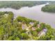 Beautiful aerial view of waterfront homes surrounded by lush greenery and lake access at 921 Oak Dr, Woodstock, GA 30189