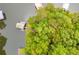 Overhead view featuring a boat dock and a shoreline bordered by the lush greenery of trees at 921 Oak Dr, Woodstock, GA 30189