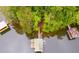 Aerial view of a waterfront property with private dock and beautiful lake access at 921 Oak Dr, Woodstock, GA 30189
