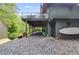Spacious backyard with a deck, dark rock ground cover, and lush greenery creates a private outdoor retreat at 921 Oak Dr, Woodstock, GA 30189