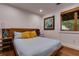 Comfortable bedroom featuring hardwood floors, large window, and unique furnishings at 921 Oak Dr, Woodstock, GA 30189