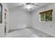 Light-filled bedroom with neutral paint, a window with blinds, and carpeting at 921 Oak Dr, Woodstock, GA 30189
