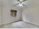 Neutral bedroom with carpet, ceiling fan, and double windows at 921 Oak Dr, Woodstock, GA 30189