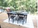 Outdoor seating area on deck with table and chairs at 921 Oak Dr, Woodstock, GA 30189