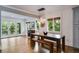 Open dining area with views to the yard from glass doors and windows and modern lighting at 921 Oak Dr, Woodstock, GA 30189