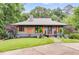 Charming home featuring a well-manicured lawn, modern facade, and beautiful landscaping at 921 Oak Dr, Woodstock, GA 30189