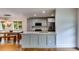 Open kitchen featuring stainless steel appliances, granite countertops, and modern light fixtures at 921 Oak Dr, Woodstock, GA 30189