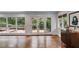 Open living room with large windows and access to an outdoor deck at 921 Oak Dr, Woodstock, GA 30189
