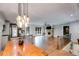 Open concept living space with a view of the updated kitchen and stone fireplace at 921 Oak Dr, Woodstock, GA 30189