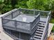 Aerial shot of rooftop deck area with seating, stairs, and a railing at 921 Oak Dr, Woodstock, GA 30189
