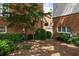 Private backyard with a mulch bed and lush green shrubs for outdoor enjoyment at 1258 Dekalb Ne Ave # 112, Atlanta, GA 30307