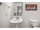 Stylish half bathroom with pedestal sink, modern decor, and clean design at 1258 Dekalb Ne Ave # 112, Atlanta, GA 30307