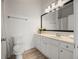 Bathroom with vanity, mirror, modern lighting and a view of the shower and commode at 1258 Dekalb Ne Ave # 112, Atlanta, GA 30307