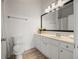 Bright bathroom featuring white cabinets, modern lighting, and a large mirror above the vanity at 1258 Dekalb Ne Ave # 112, Atlanta, GA 30307