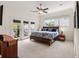 This spacious bedroom features light-colored carpet, ceiling fan, and access to a private balcony through glass doors at 1258 Dekalb Ne Ave # 112, Atlanta, GA 30307