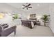 Spacious bedroom with a ceiling fan, a large window, and neutral-toned carpet at 1258 Dekalb Ne Ave # 112, Atlanta, GA 30307