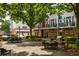 Community courtyard and grill area. Features a brick patio, wrought iron furniture and gas grills at 1258 Dekalb Ne Ave # 112, Atlanta, GA 30307