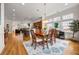 Bright, open-concept dining area featuring hardwood floors and seamlessly blending into living space at 1258 Dekalb Ne Ave # 112, Atlanta, GA 30307