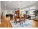 Bright dining room with hardwood floors, modern light fixture, and large windows at 1258 Dekalb Ne Ave # 112, Atlanta, GA 30307