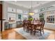 Bright dining room with large windows, hardwood floors, and a stylish light fixture at 1258 Dekalb Ne Ave # 112, Atlanta, GA 30307