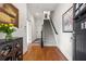 Spacious foyer features hardwood floors, staircase, and stylish decor at 1258 Dekalb Ne Ave # 112, Atlanta, GA 30307