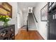 Elegant foyer featuring hardwood floors, a staircase, and sophisticated decor at 1258 Dekalb Ne Ave # 112, Atlanta, GA 30307