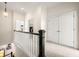 Upstairs hallway landing featuring a laundry closet and a large storage closet at 1258 Dekalb Ne Ave # 112, Atlanta, GA 30307