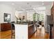 Spacious kitchen flowing into the living area, featuring hardwood floors and stainless steel appliances at 1258 Dekalb Ne Ave # 112, Atlanta, GA 30307