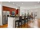Elegant kitchen with stainless steel appliances, granite countertops, and breakfast bar open to the living space at 1258 Dekalb Ne Ave # 112, Atlanta, GA 30307